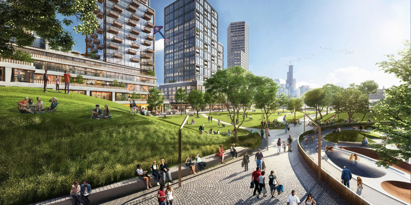 A city with tall, modern glass-fronted buildings and a lively pedestrian green space in the foreground