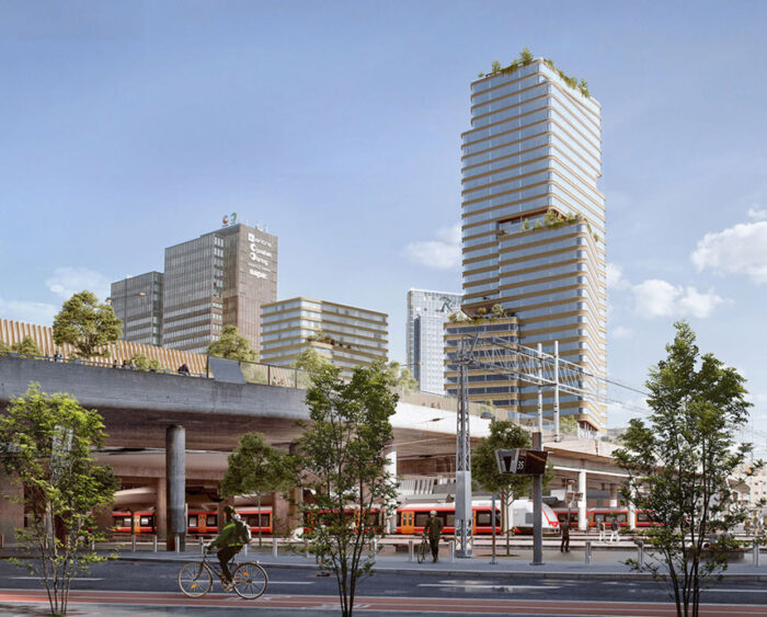 A city with tall, modern glass-fronted buildings